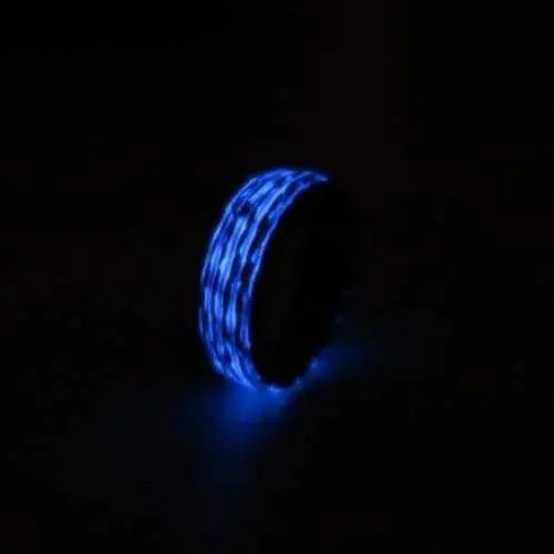 Glow in the dark mens wedding ring with fordite material inner band